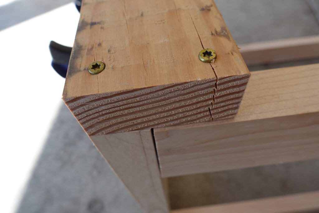 Close up of screws splitting the wood
