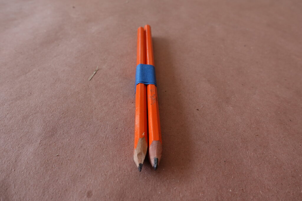 Two pencils taped together
