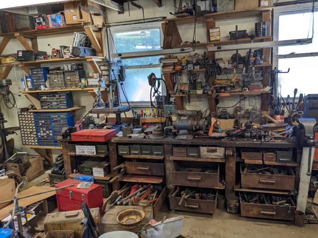A messy garage with tools everywhere