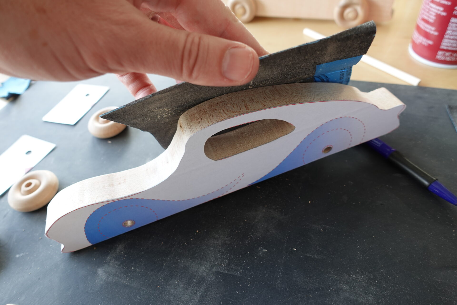 Sanding edges of the pieces