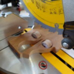 Testing the miter saw to cut the cylinders in half