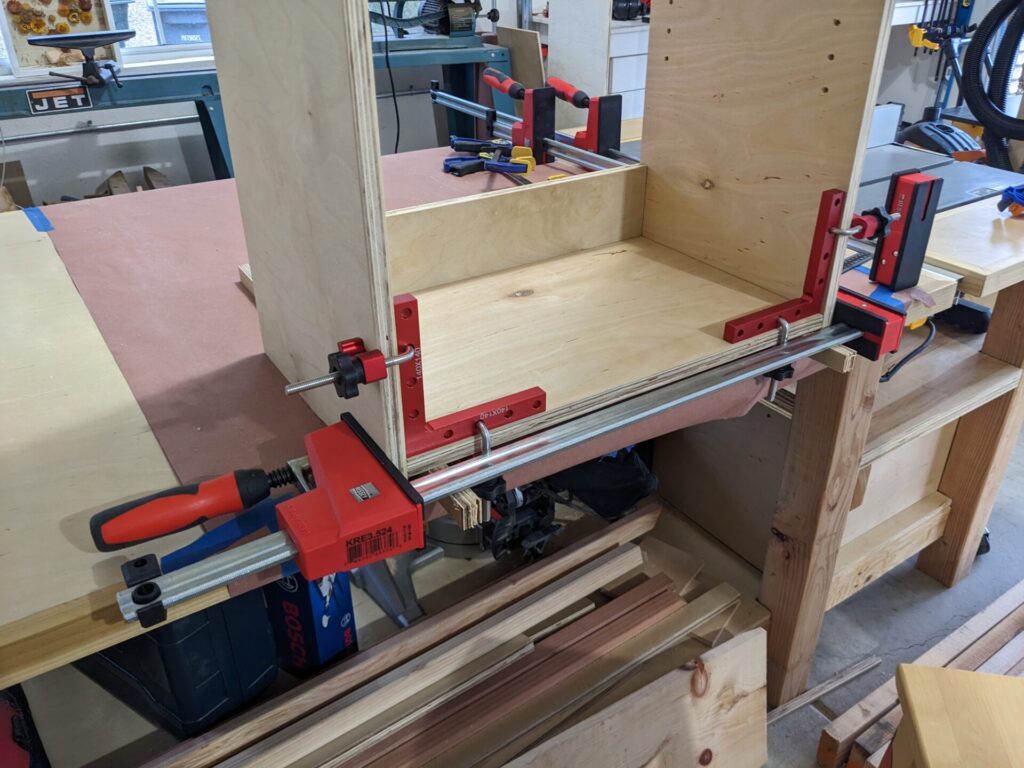 Glue up of a cabinet with clamps