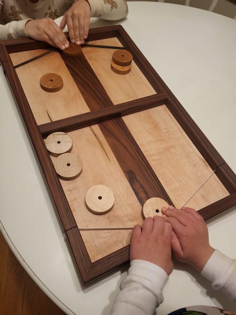 Kids playing the bomb bomb board