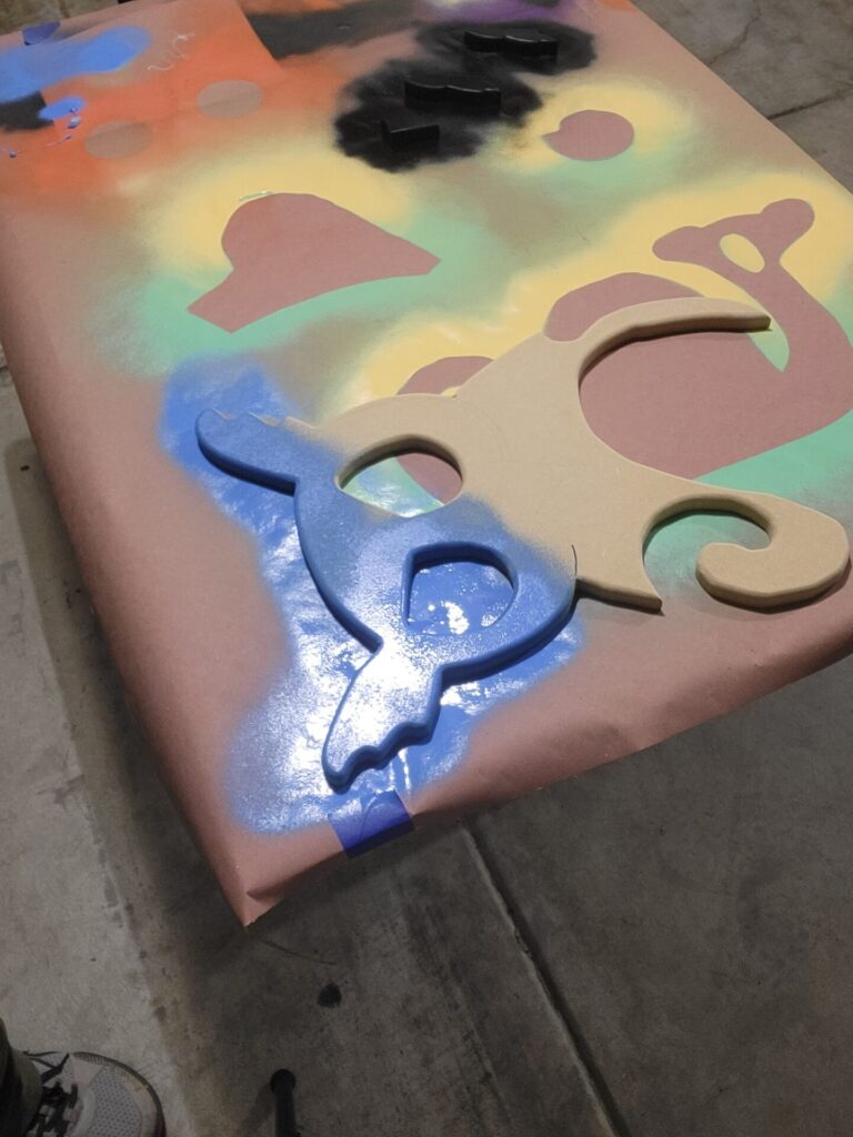 Spray painting the owl.