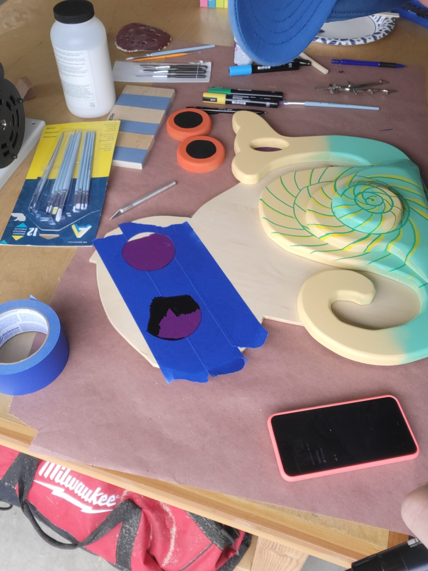 Hand painting the snail and owl